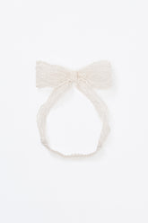 Avauma ivory lace ribbon headband laid flat on white background